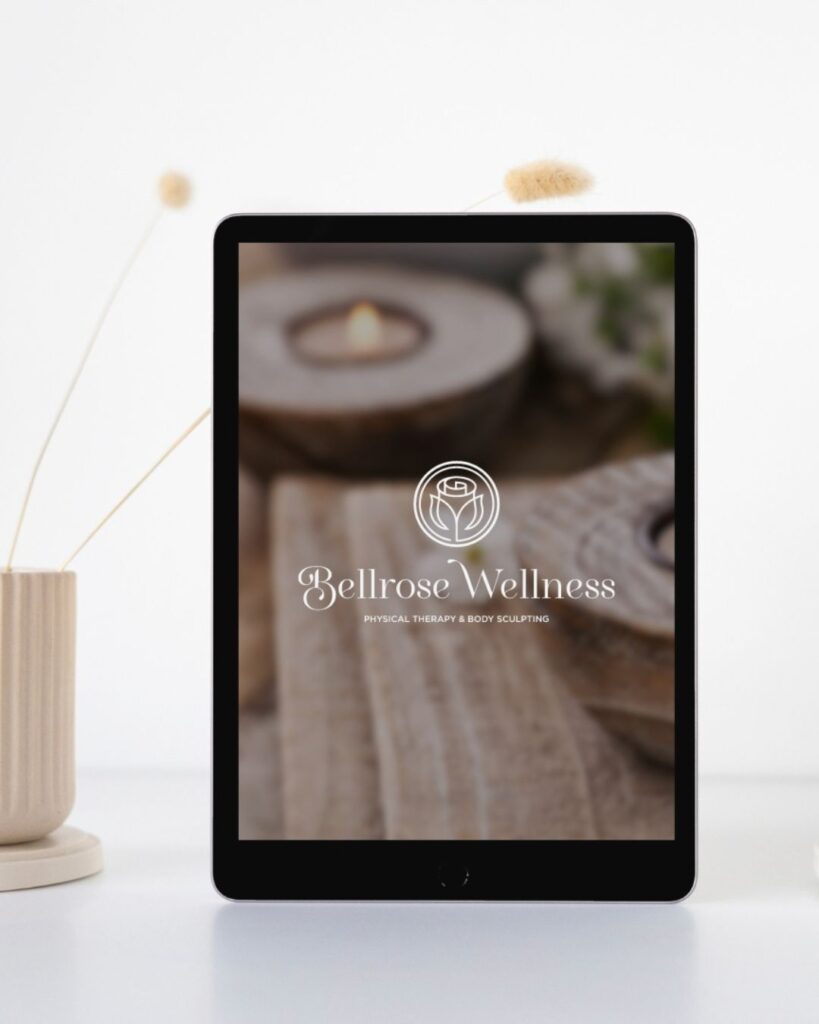 Elegant and calm wellness logo design displayed over a photo of a burning tea candle shown on an iPad screen.