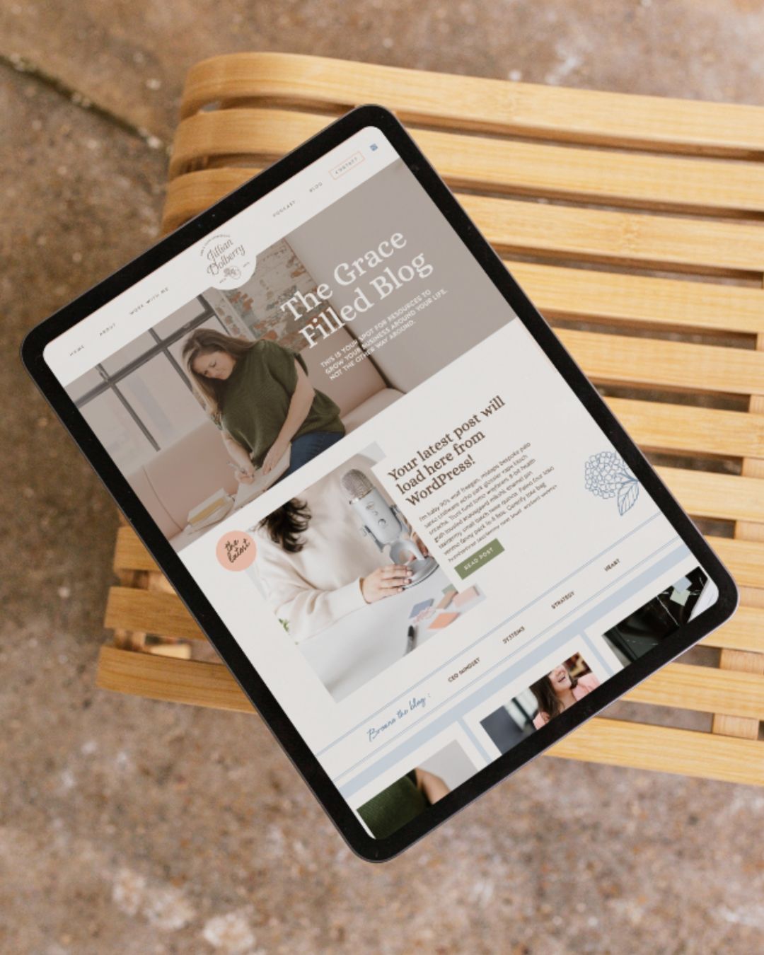 Website mockup on Ipad of Jillian Dolberry’s gentle brand design, featuring soft colors and floral accents.