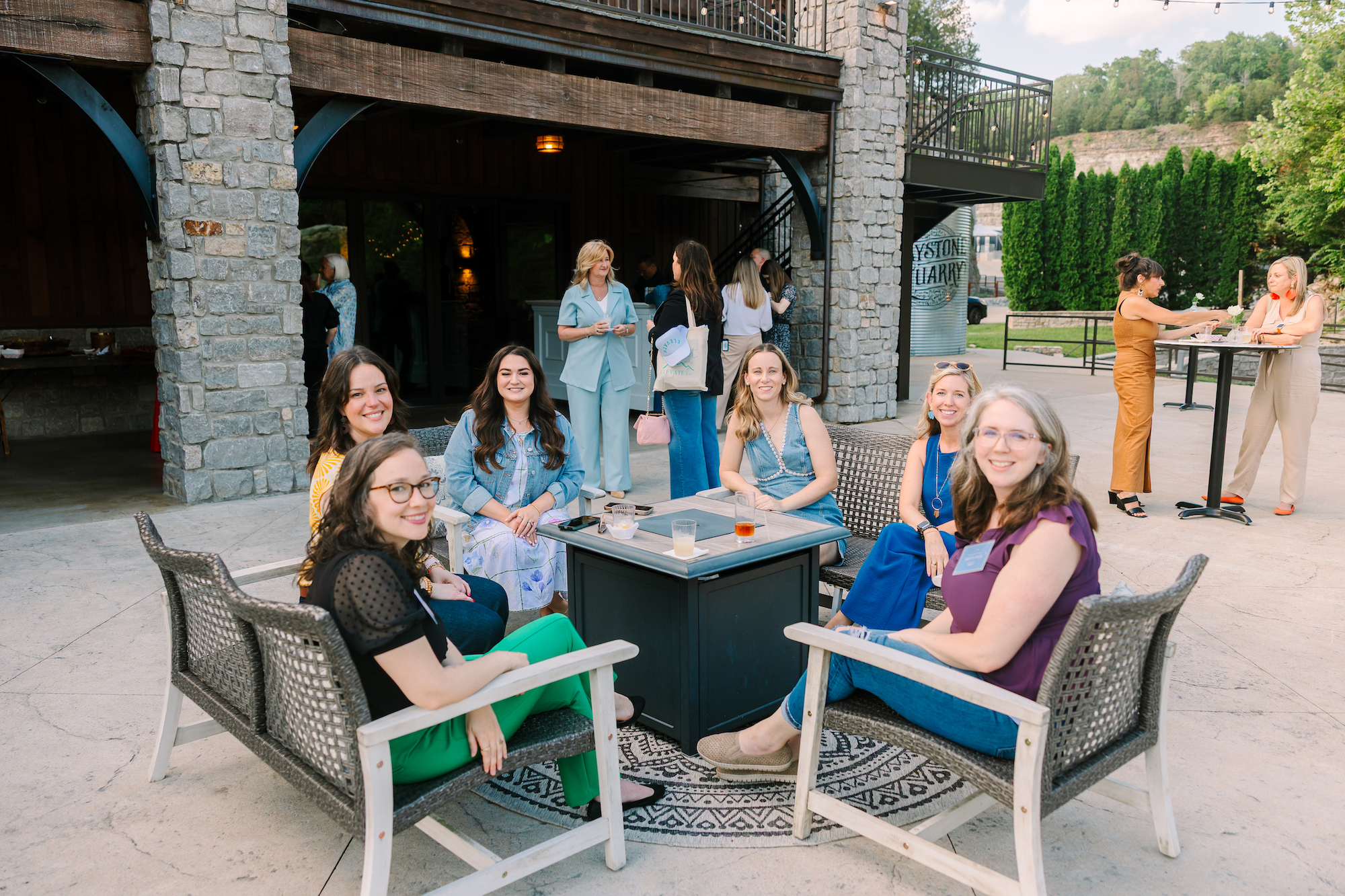 Makena sitting around a fire pit with other entrepreneurs