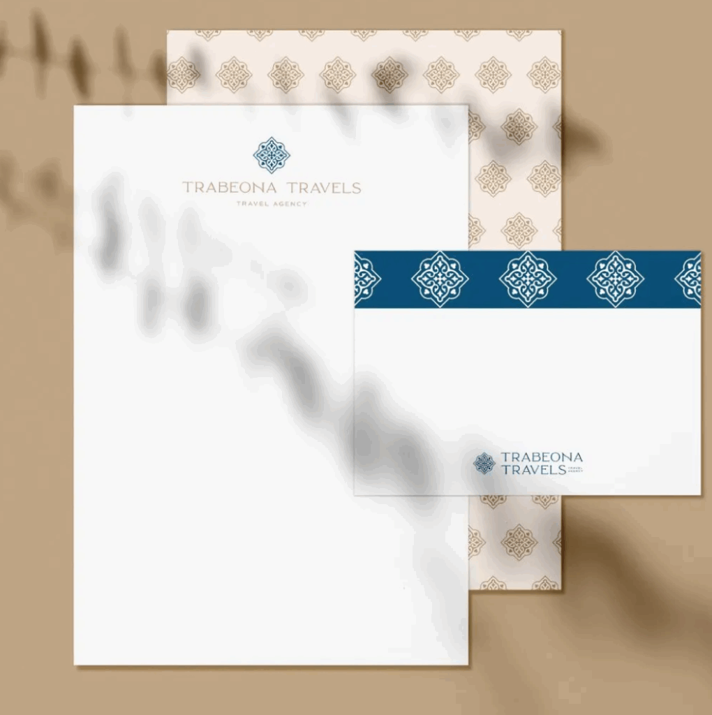 Stationary branded with a logo and intricate pattern for "Trabeona Travels"